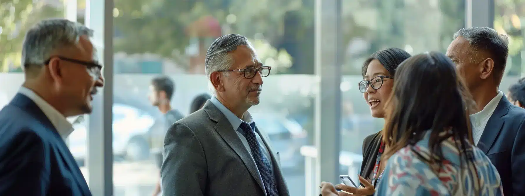 a diverse group of people engaged in intense conversations during a business meeting.